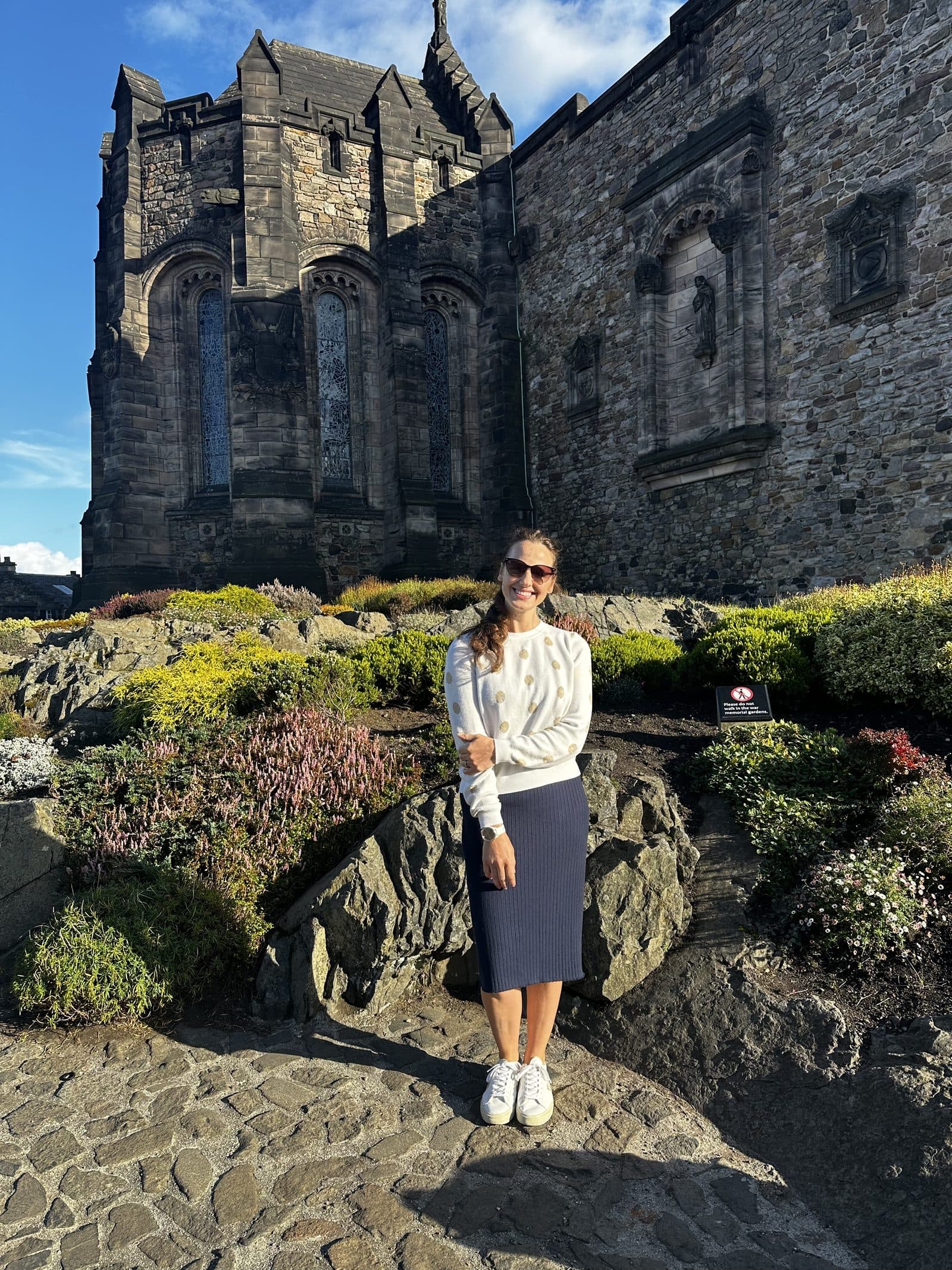 A traveler on the path below the castle rock in Edinburgh
