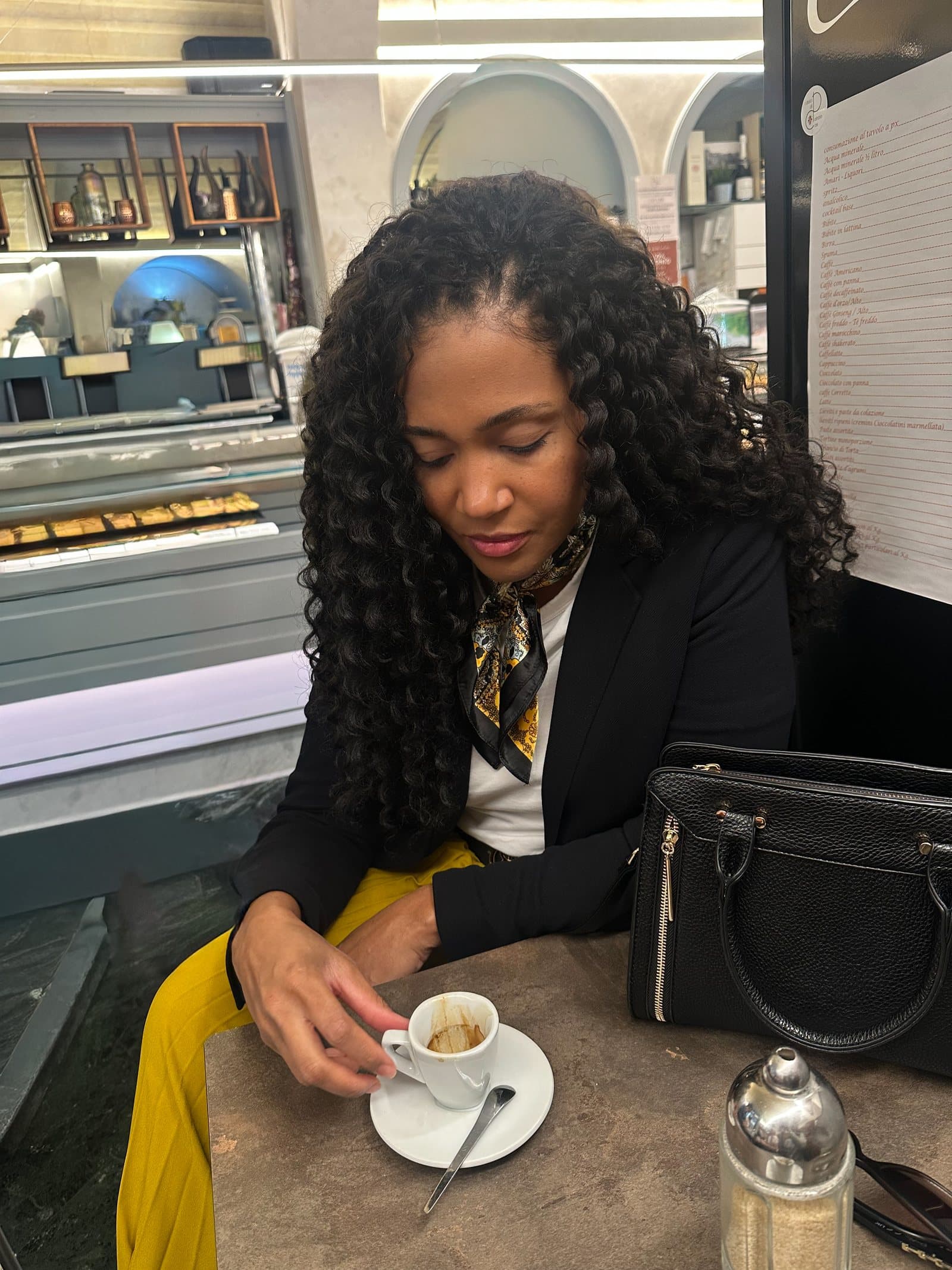 Kerry-Ann Stephens over an espresso at a counter in Florence