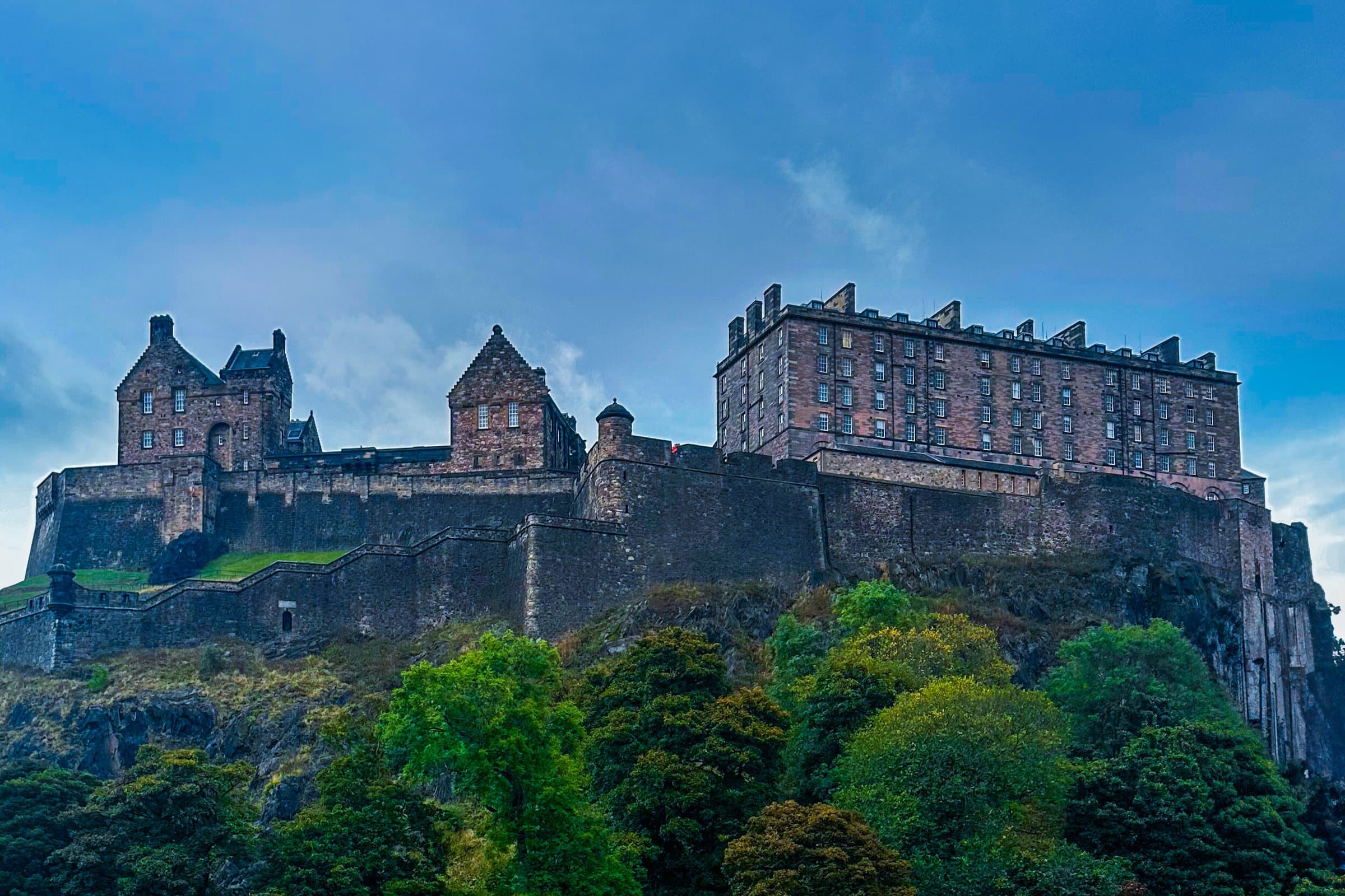 Edinburgh Castle on its crag above the trees of Princes Street Gardens