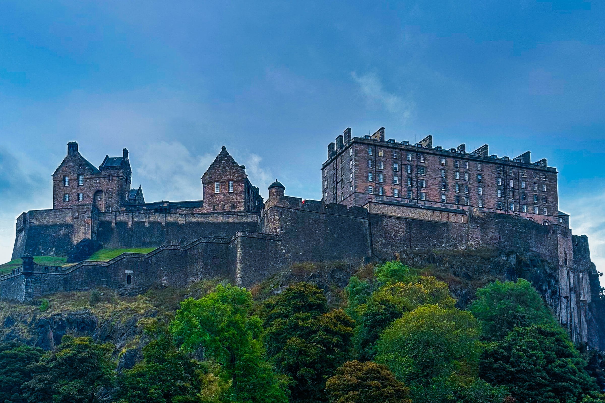 Edinburgh Castle on its crag above the trees of Princes Street Gardens
