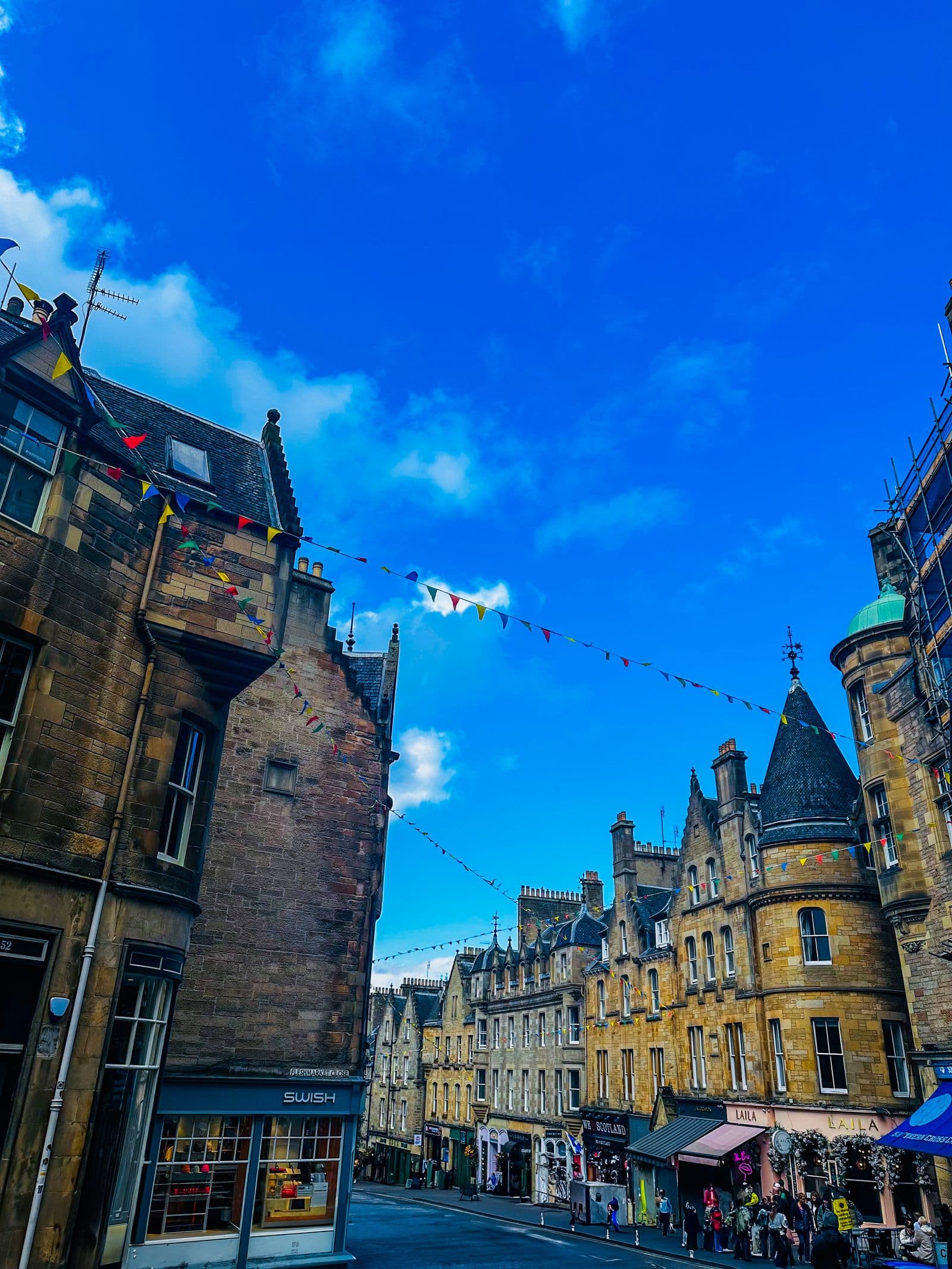 The curving painted shopfronts of Victoria Street in Edinburgh