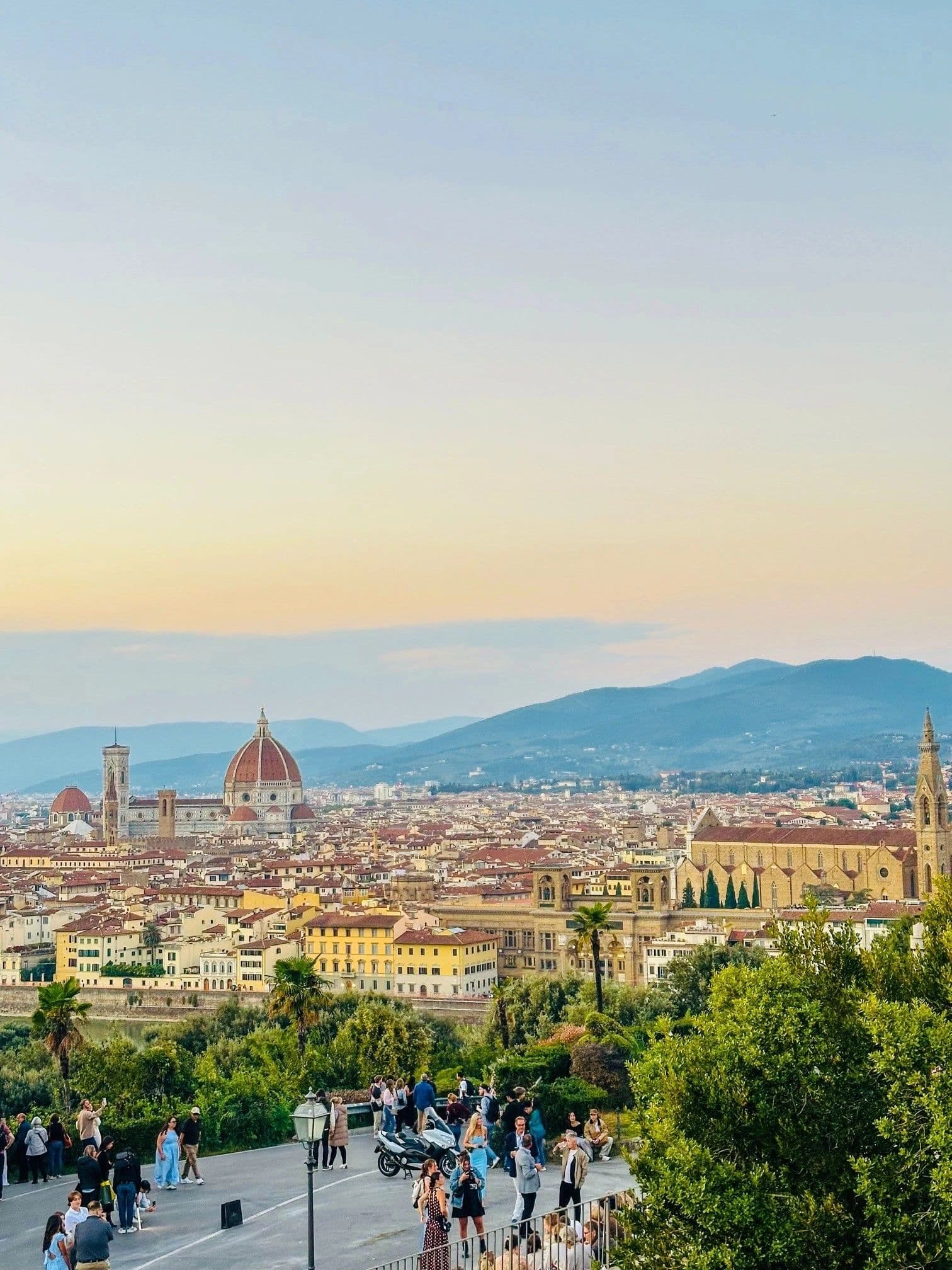 Florence at sunset seen from Piazzale Michelangelo, the Duomo rising above terracotta rooftops